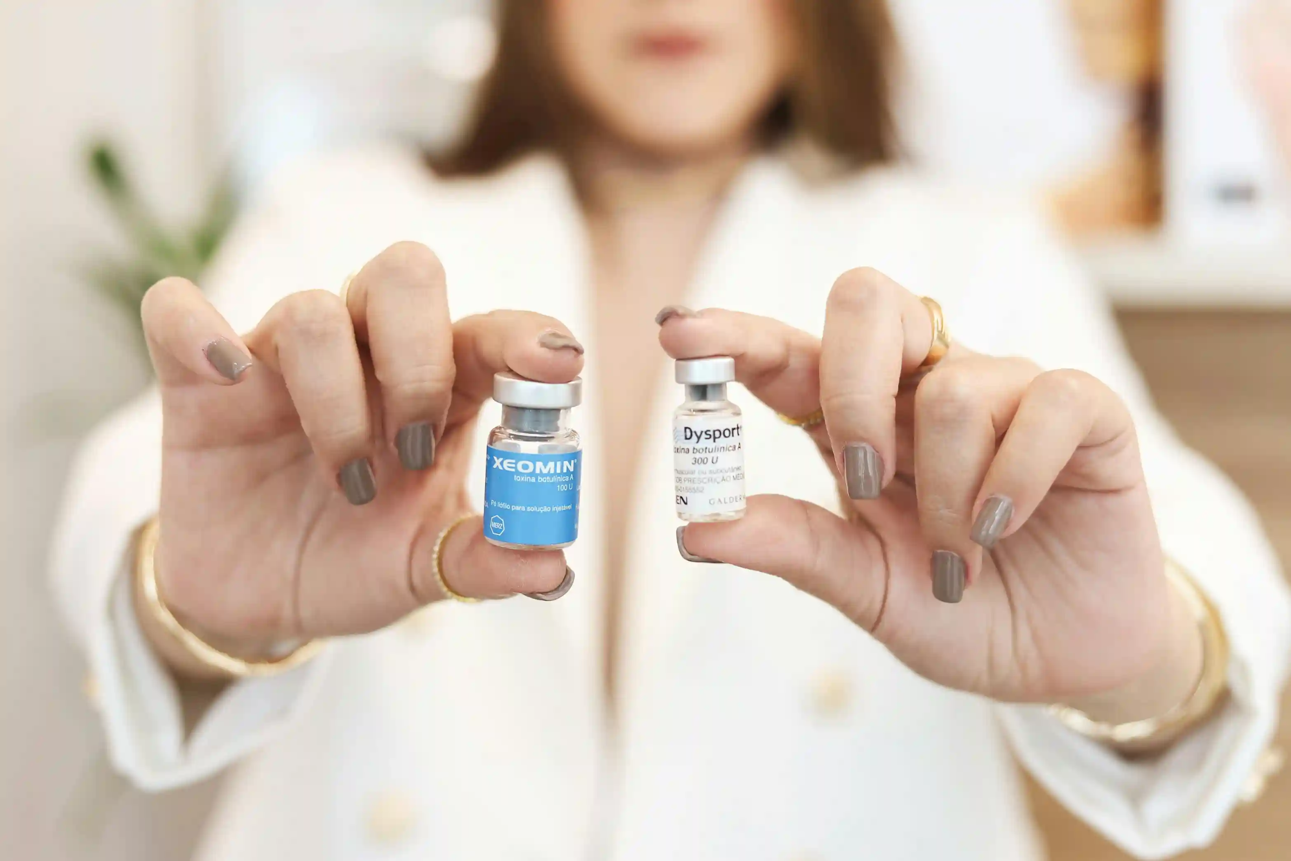Doctor showing two bottles of Botox medicine