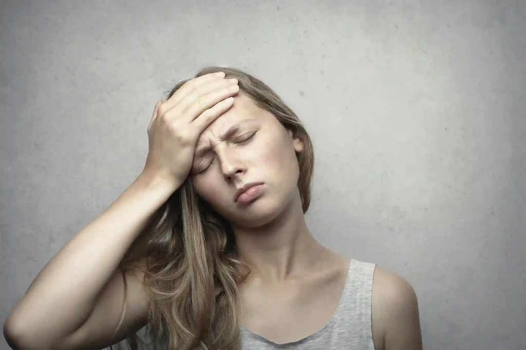Woman in discomfort due to migraine